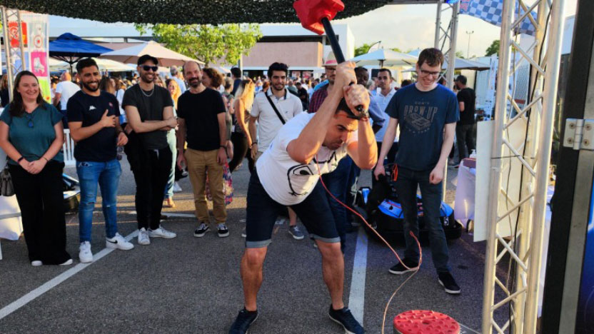 Employees play at a Guinguette party