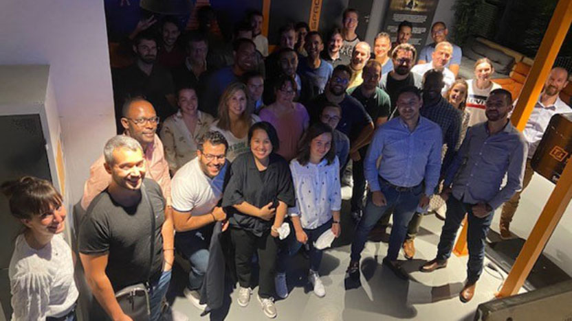 Staff members of the Paris agency posing for a photograph